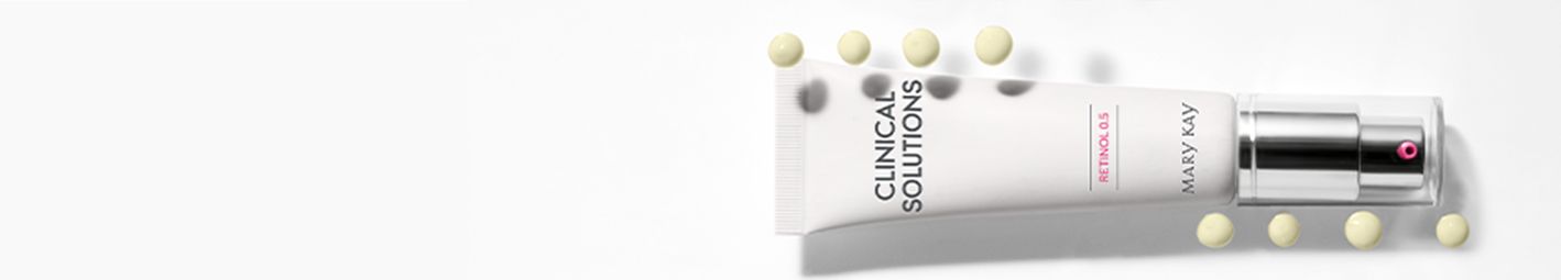 Photo of Clinical Solutions™ Retinol 0.5 with pea-sized drops of the formula.