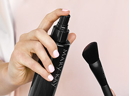 Close-up of Mary Kay Brush Cleaner posed to be sprayed on the Mary Kay Cheek Brush.