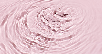 Брижі води на рожевому фоні, що символізує зволоженність
