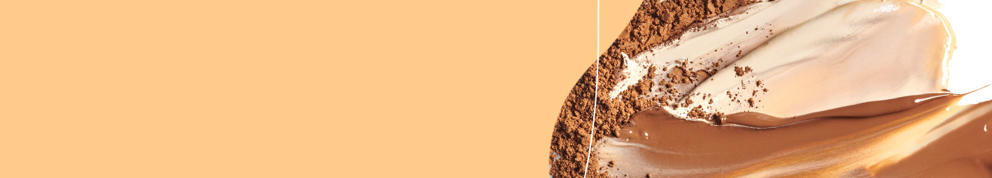 Mary Kay eye makeup product rubs against orange background