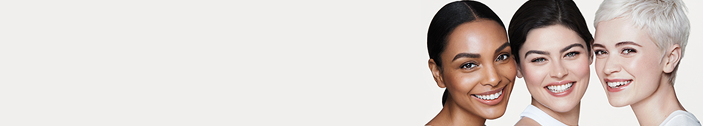 A picture of one black woman and two white women with clear, glowing skin