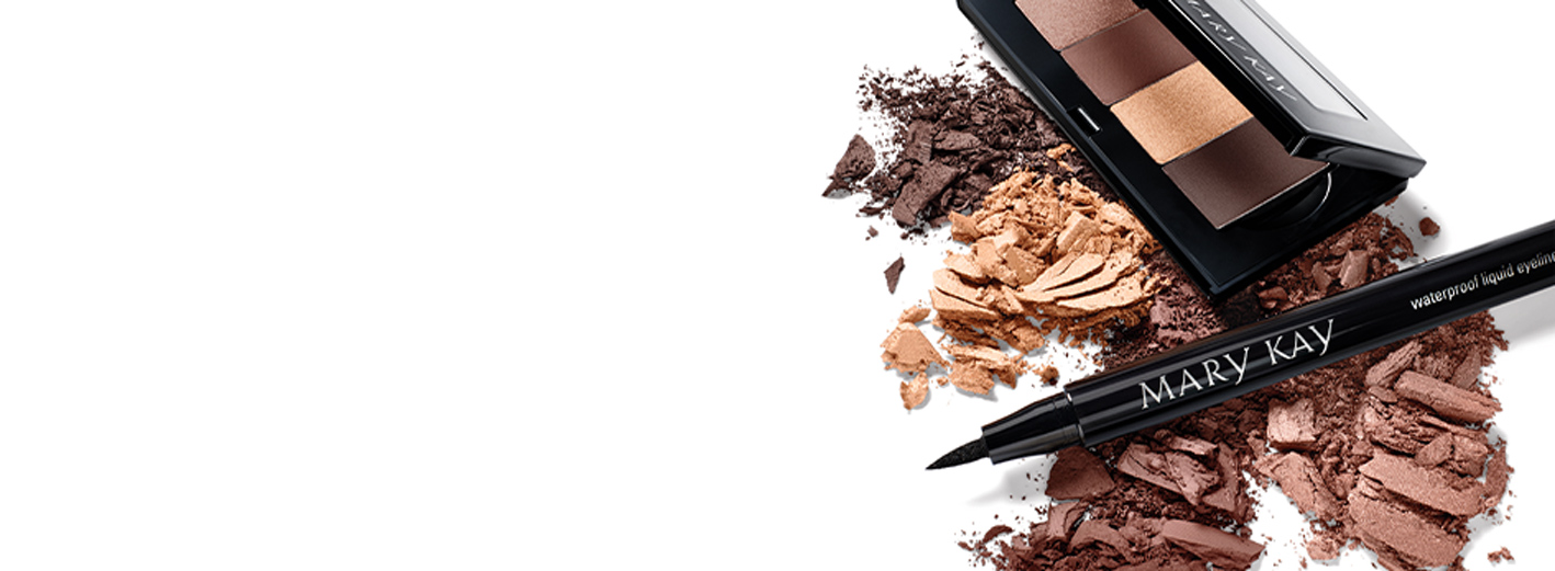 Eye shadow palette with neutral shades paired with waterproof eyeliner pen on top of eye shadow rubs in neutral shades on a white background.