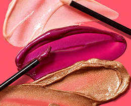 Mary Kay Unlimited Lip Gloss applicators on top of their accompanying product rubs.